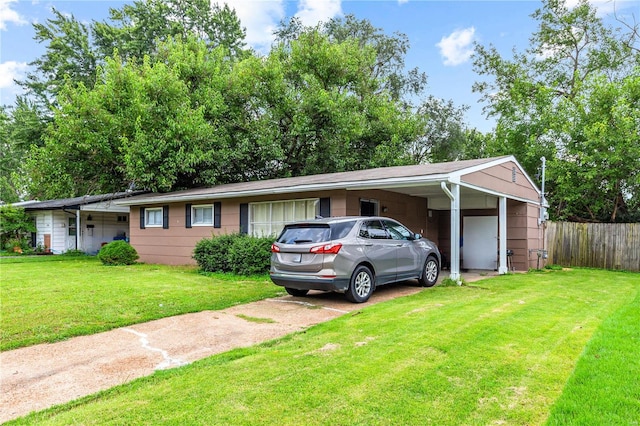 ranch-style house with a carport and a front lawn