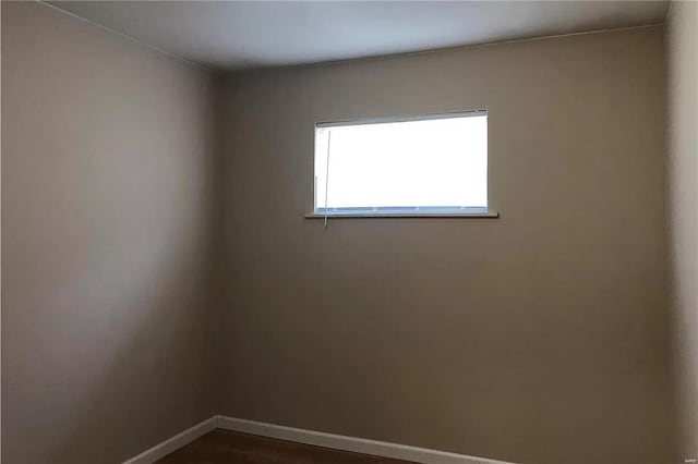 empty room with baseboards