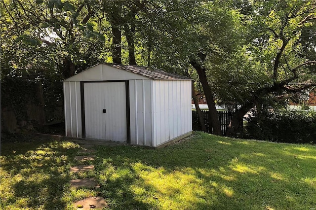 view of shed with fence