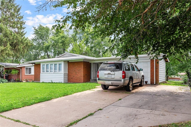 single story home featuring a front lawn and a garage