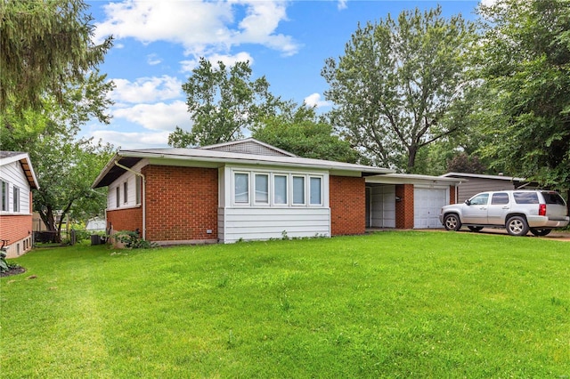 ranch-style house with a front lawn and a garage