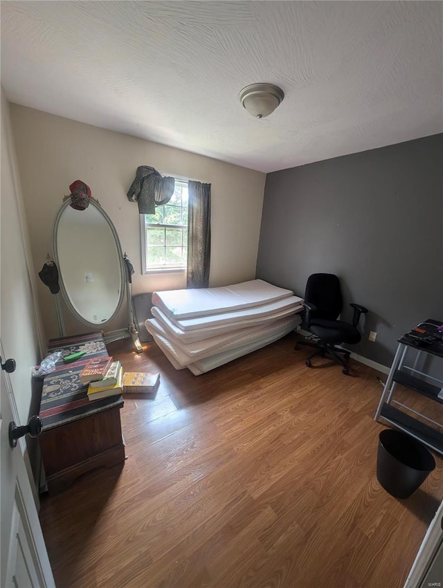 bedroom featuring hardwood / wood-style flooring