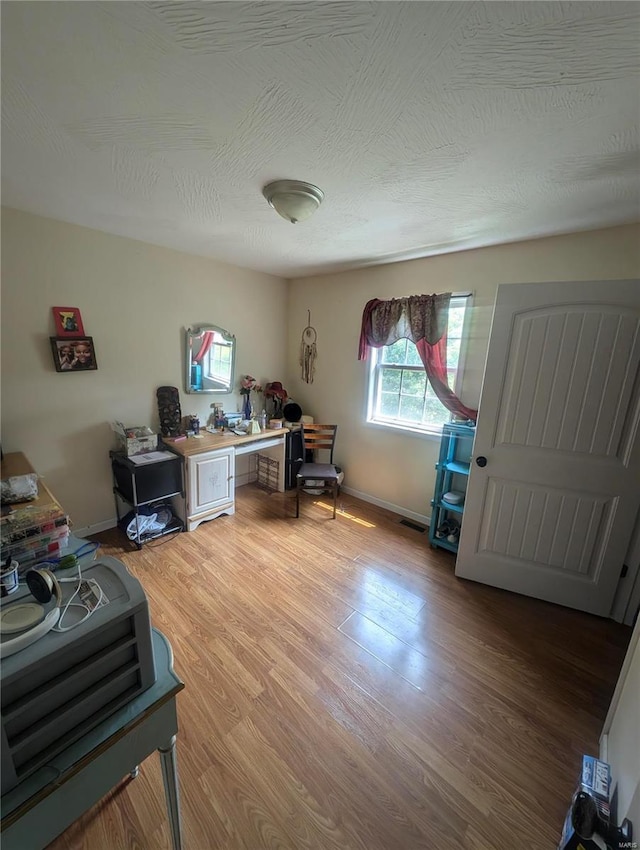 office space with hardwood / wood-style floors