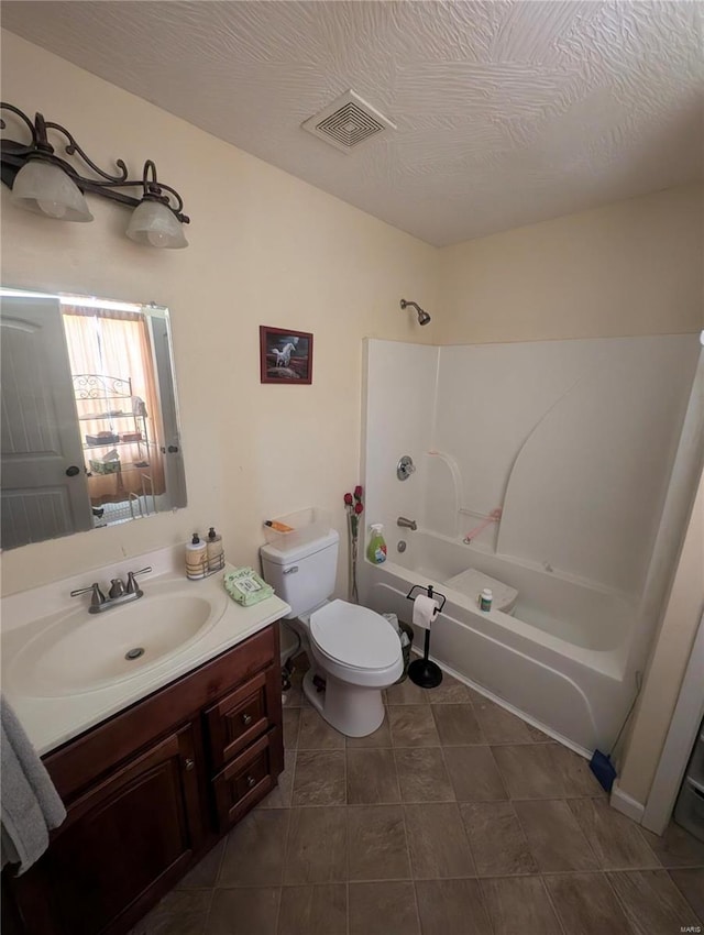 full bathroom with  shower combination, tile patterned floors, toilet, and vanity