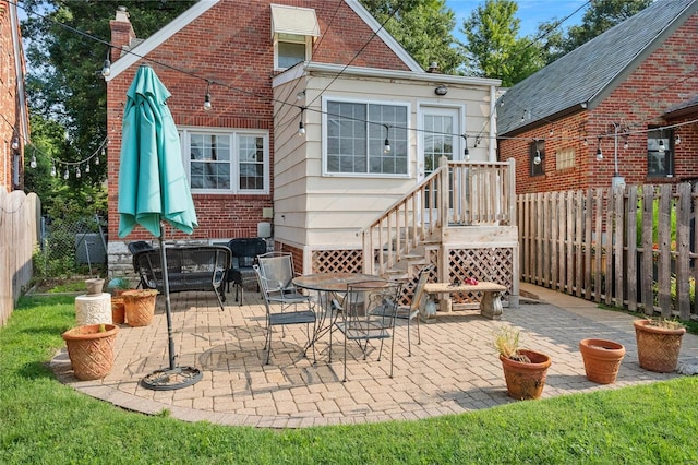 rear view of house featuring a patio