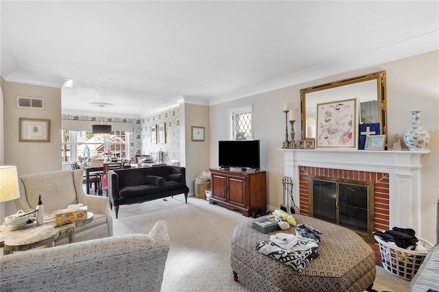 carpeted living room with a brick fireplace and ornamental molding