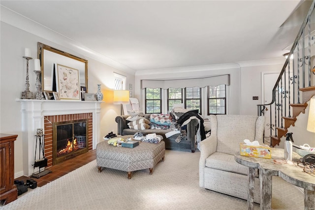 living room with crown molding and a brick fireplace