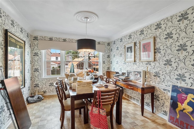 dining area with parquet flooring