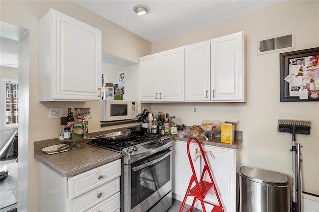 kitchen featuring white cabinetry and stainless steel range with gas cooktop