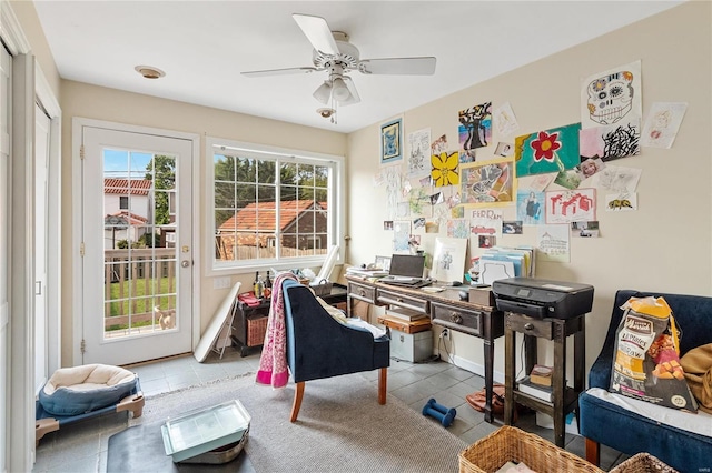 tiled office featuring ceiling fan