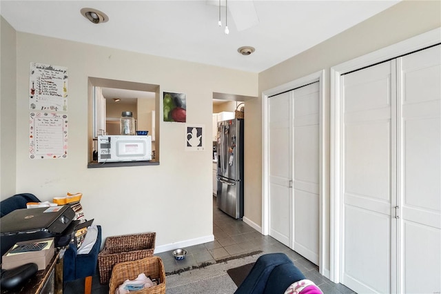 living area with dark tile patterned floors