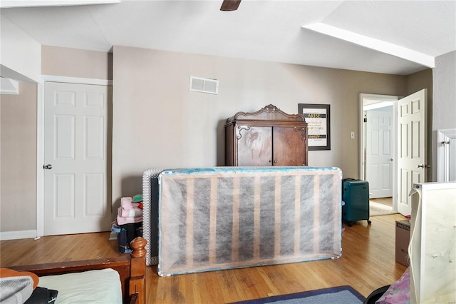 bedroom with hardwood / wood-style flooring and ceiling fan