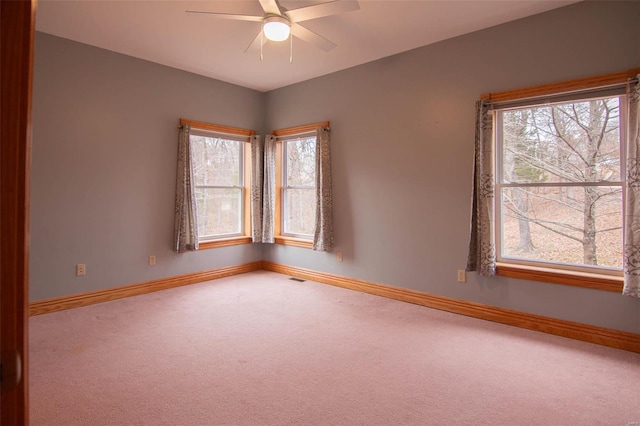 spare room with carpet flooring and ceiling fan