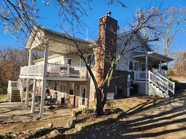 rear view of property with a patio area