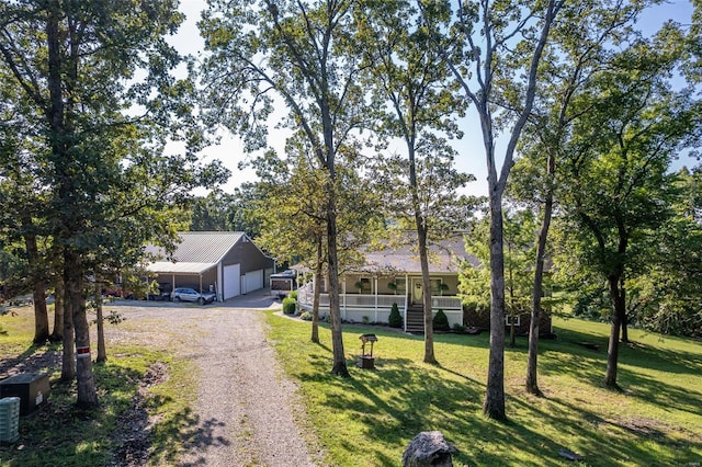 view of front of home featuring covered porch and a front lawn