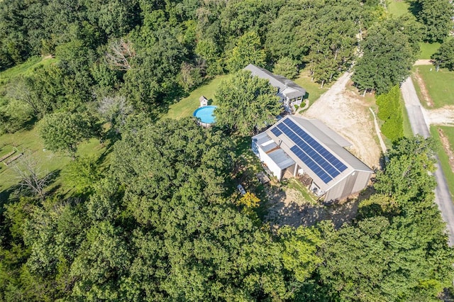 birds eye view of property with a forest view