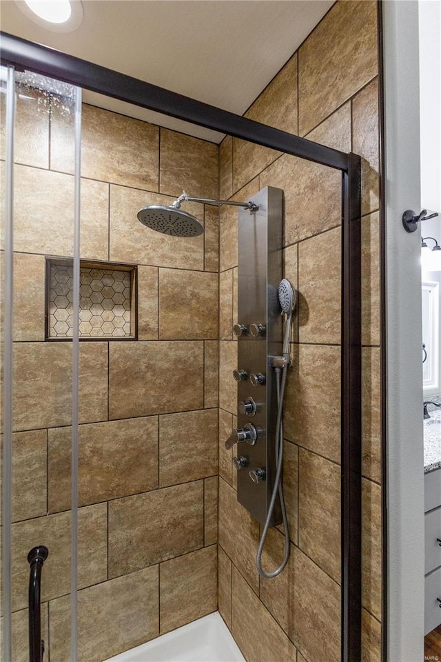 full bath with a shower stall