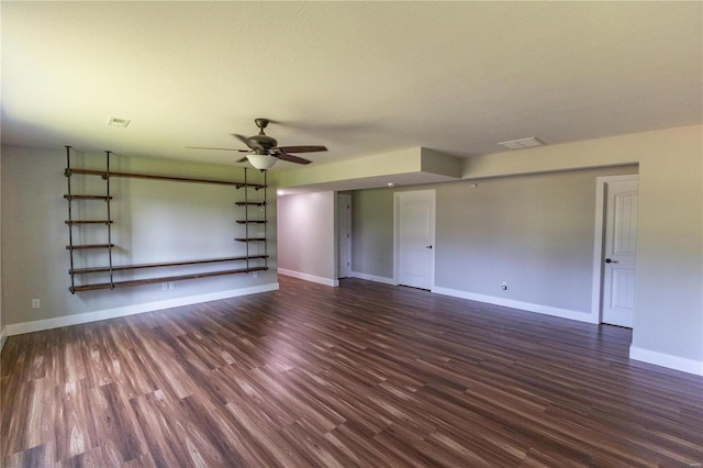 unfurnished living room featuring baseboards, a ceiling fan, wood finished floors, and visible vents