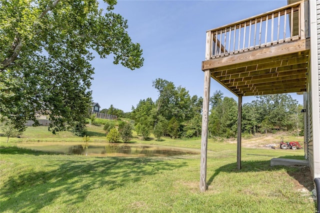 view of yard featuring a deck with water view