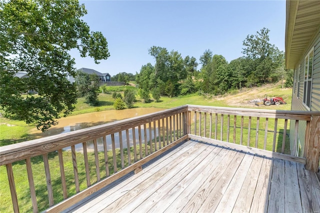 deck featuring a water view and a yard