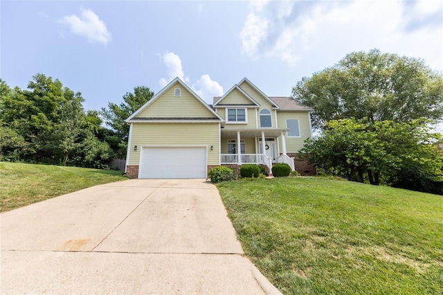 view of front facade featuring a porch, a garage, and a front yard