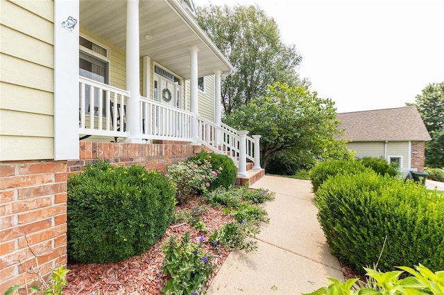 view of side of property featuring a porch