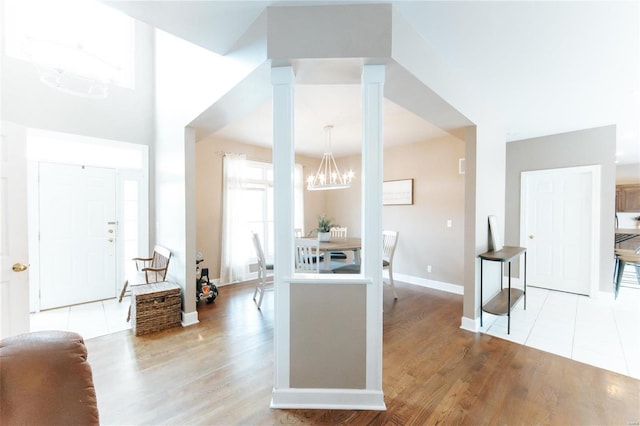 kitchen featuring light hardwood / wood-style floors and a notable chandelier