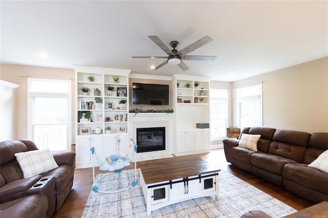 living room with hardwood / wood-style flooring and ceiling fan