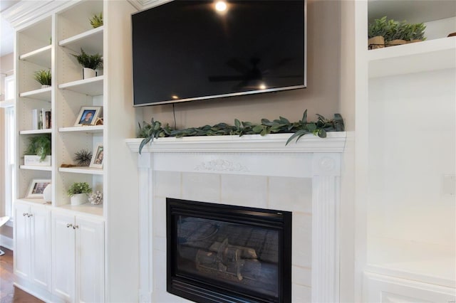 room details featuring a tiled fireplace