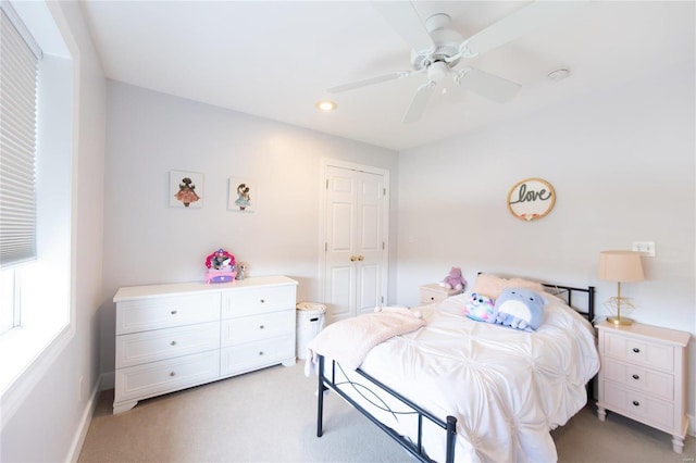 carpeted bedroom featuring ceiling fan