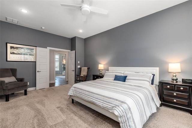 bedroom with ceiling fan and light colored carpet