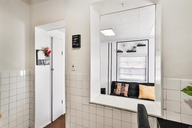 interior space featuring tile walls