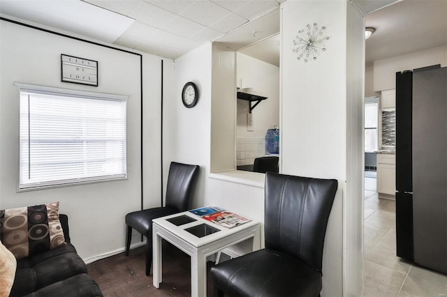 sitting room featuring tile patterned floors