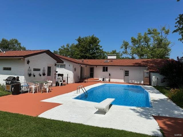 back of house with a patio area