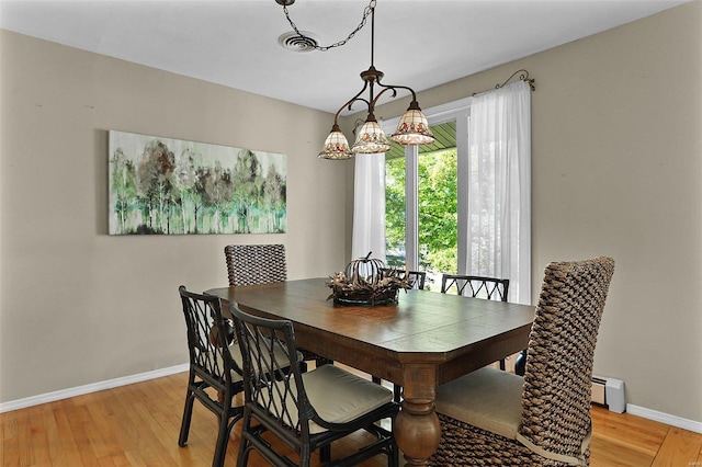 dining space with light wood-type flooring