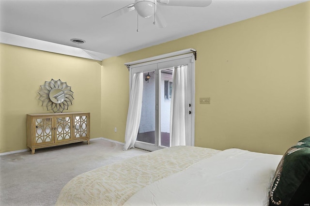 bedroom featuring light carpet, access to outside, and ceiling fan