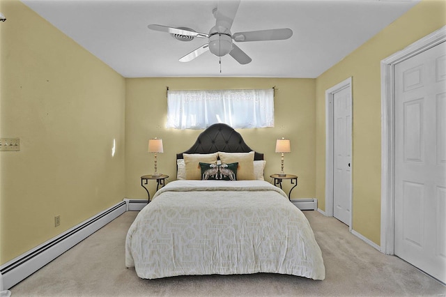 bedroom with ceiling fan, a baseboard radiator, and light colored carpet