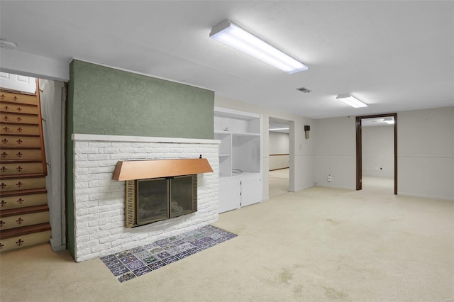 unfurnished living room featuring a fireplace and carpet