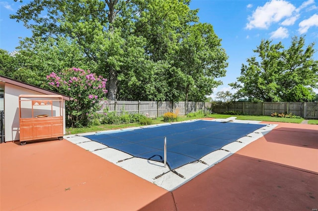 view of swimming pool with a patio area