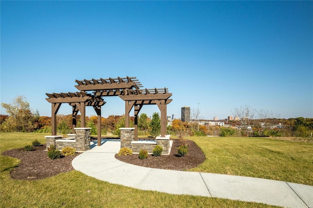 view of home's community featuring a yard and a pergola