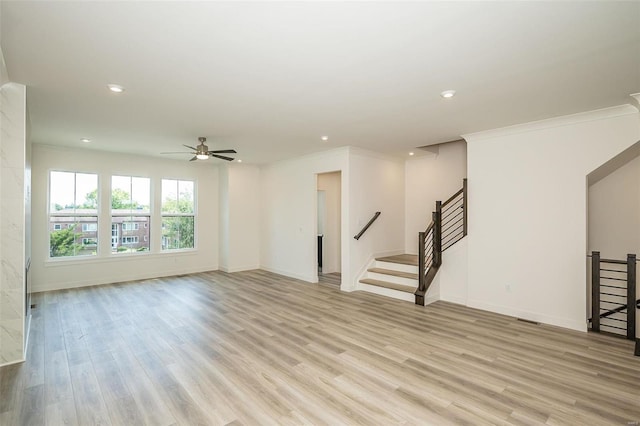 unfurnished room with light hardwood / wood-style flooring, ceiling fan, and ornamental molding