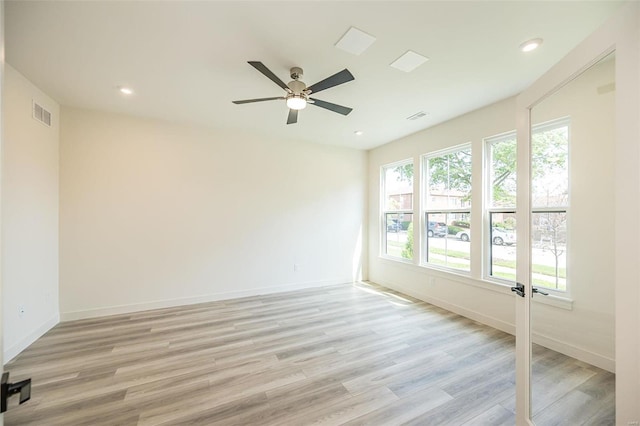 unfurnished room featuring light wood-type flooring and ceiling fan