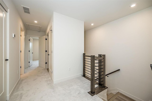 corridor with light colored carpet