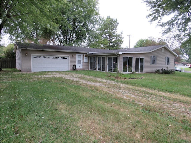 single story home featuring a garage and a front yard