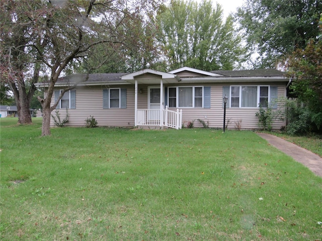 ranch-style home with a front lawn