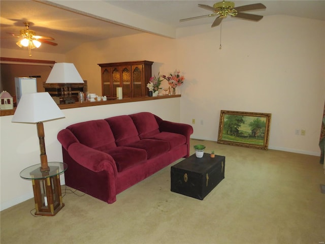 carpeted living room featuring ceiling fan and beamed ceiling