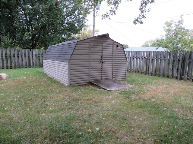 view of outbuilding with a lawn