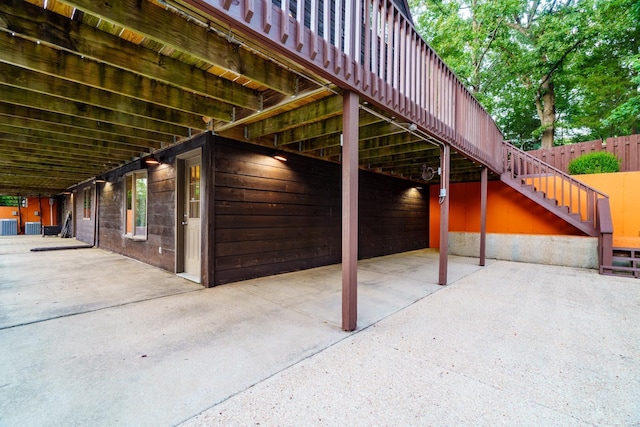 view of patio / terrace with stairs and central AC unit