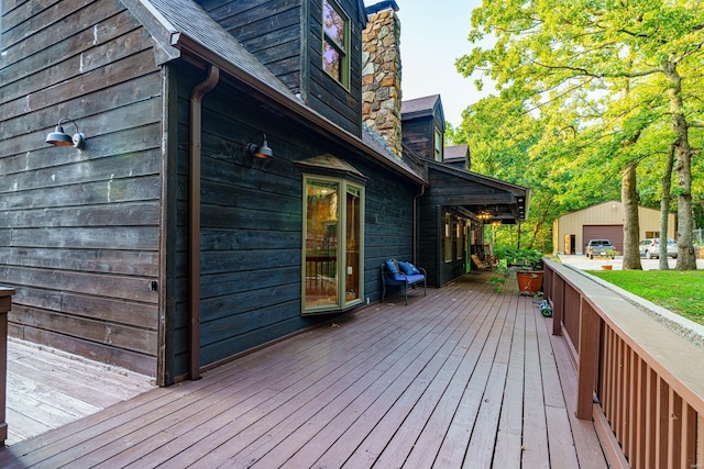 wooden deck with an outbuilding