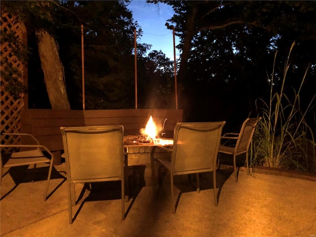 view of patio / terrace with an outdoor fire pit and outdoor dining area